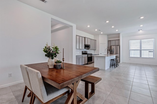 dining space with recessed lighting, visible vents, baseboards, and light tile patterned floors