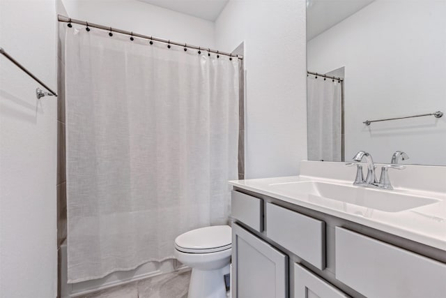 bathroom featuring shower / tub combo with curtain, vanity, and toilet