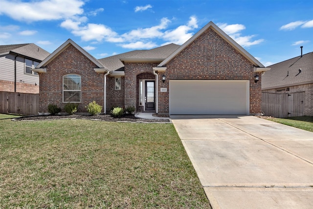 view of front of home featuring driveway, an attached garage, fence, a front yard, and brick siding