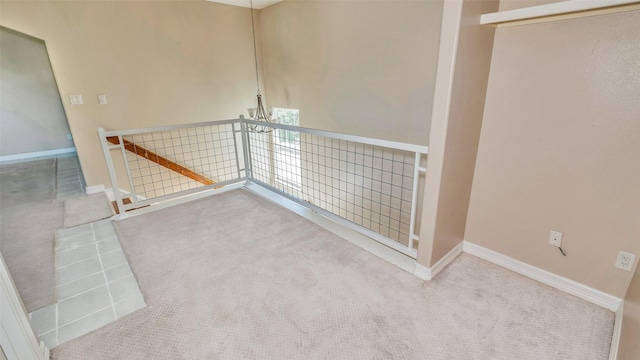 spare room with carpet flooring and baseboards