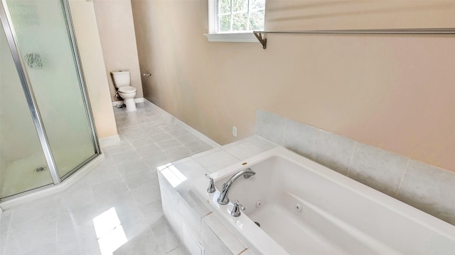 bathroom featuring a tub with jets, a shower stall, toilet, and tile patterned floors