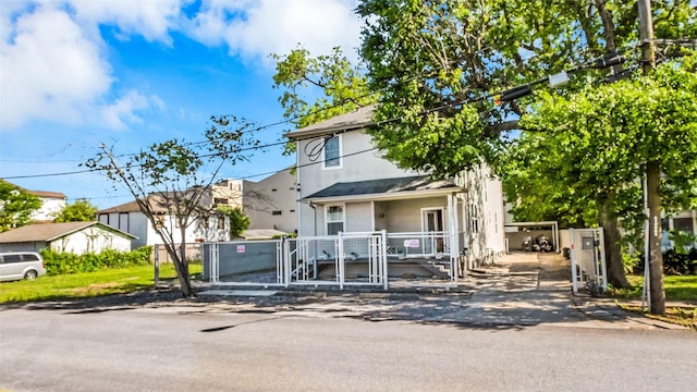 view of front of house featuring a gate and fence