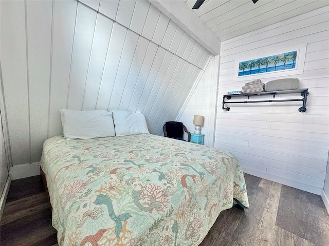 310 Angel Wing St, Surfside Beach, TX 77541 - bedroom featuring wood walls, a ceiling fan, wood finished floors, and beamed ceiling