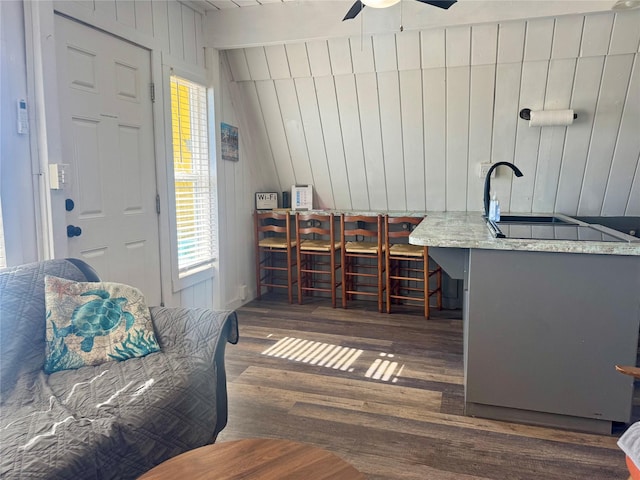 310 Angel Wing St, Surfside Beach, TX 77541 - office with a ceiling fan, wooden walls, and wood finished floors
