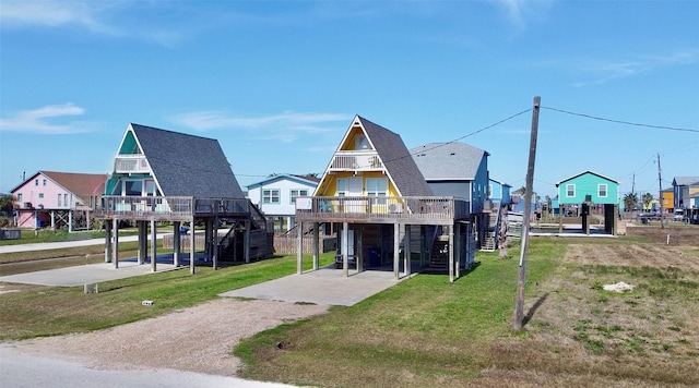 310 Angel Wing St, Surfside Beach, TX 77541 - view of property's community featuring stairway and a lawn
