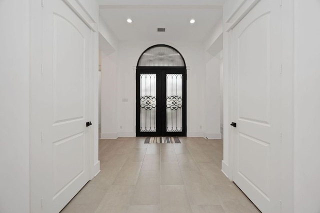 entryway featuring recessed lighting, visible vents, baseboards, and french doors