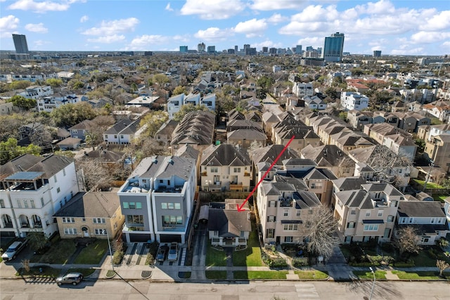 birds eye view of property with a residential view