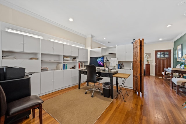 office featuring light wood-style floors, recessed lighting, and crown molding