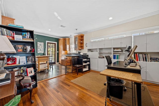 office space with visible vents, ornamental molding, hardwood / wood-style floors, and recessed lighting