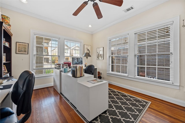 office with a ceiling fan, visible vents, baseboards, ornamental molding, and dark wood-style floors