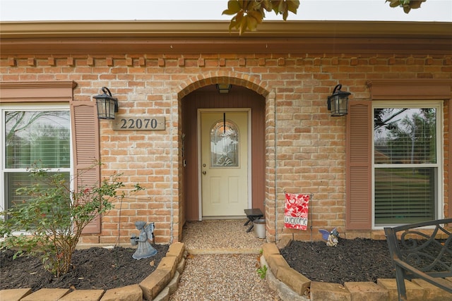 entrance to property with brick siding