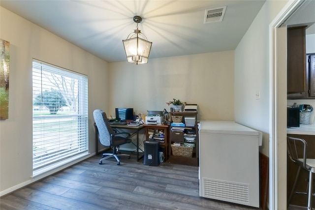 office area with visible vents and wood finished floors