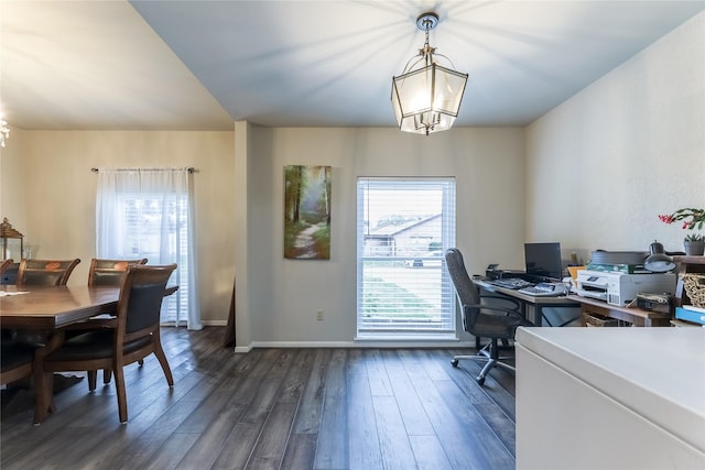 office space featuring a healthy amount of sunlight, baseboards, dark wood-type flooring, and a notable chandelier