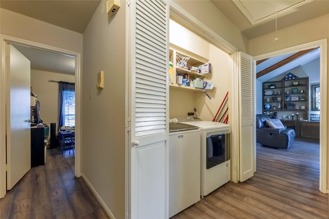 laundry area with laundry area, baseboards, independent washer and dryer, dark wood-style floors, and attic access