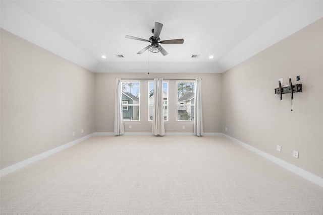 empty room featuring baseboards, lofted ceiling, a ceiling fan, and recessed lighting