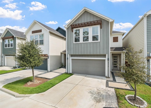 view of front of house featuring a garage, concrete driveway, and board and batten siding