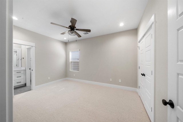 bedroom featuring recessed lighting, visible vents, light carpet, connected bathroom, and baseboards