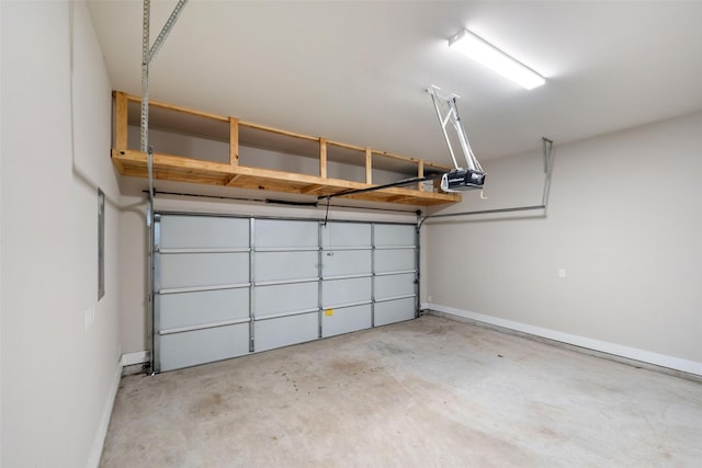 garage featuring a garage door opener and baseboards