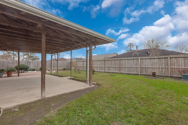 view of yard with a fenced backyard and a patio