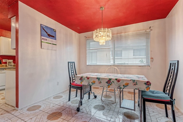 dining space featuring an inviting chandelier