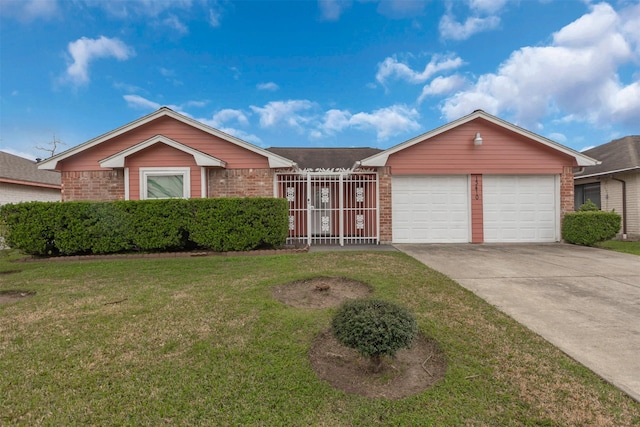 single story home featuring a garage, a front yard, concrete driveway, and brick siding