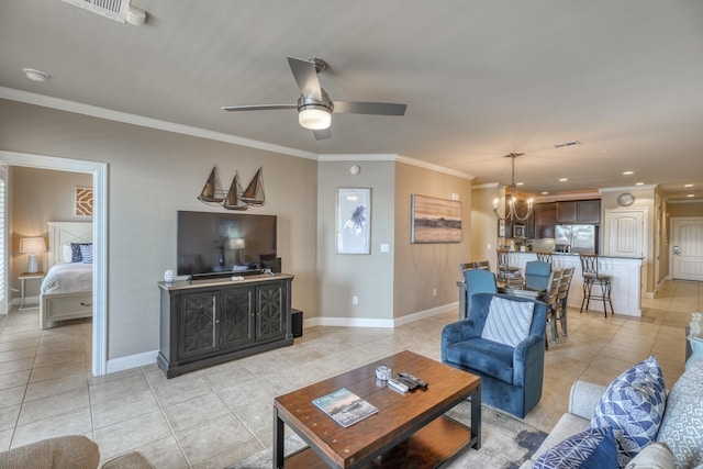 living room featuring light tile patterned floors, ceiling fan with notable chandelier, visible vents, baseboards, and crown molding