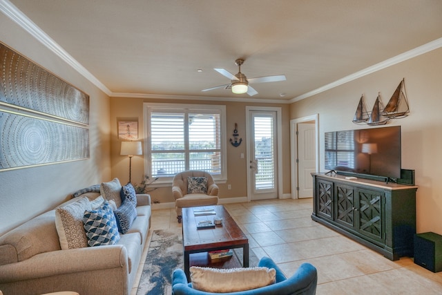 living room with baseboards, a ceiling fan, crown molding, and light tile patterned flooring