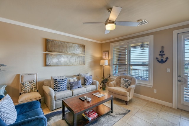 living room featuring ornamental molding, a wealth of natural light, visible vents, and light tile patterned floors