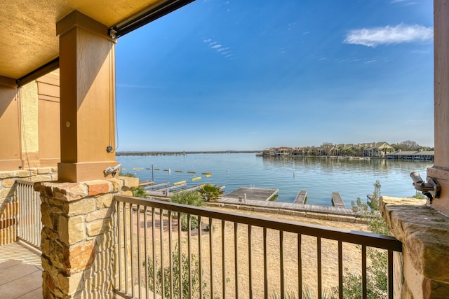 balcony featuring a water view