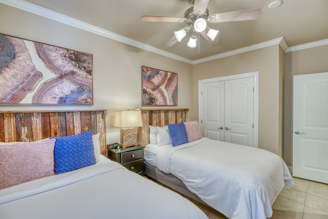 bedroom featuring a closet, tile patterned flooring, a ceiling fan, and crown molding