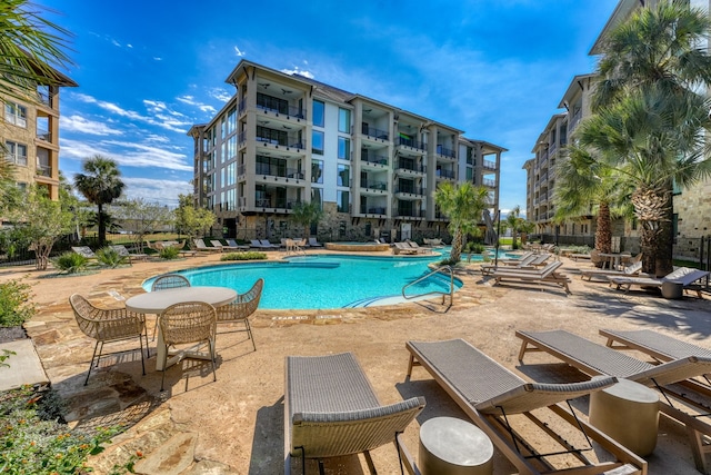 pool with a patio area