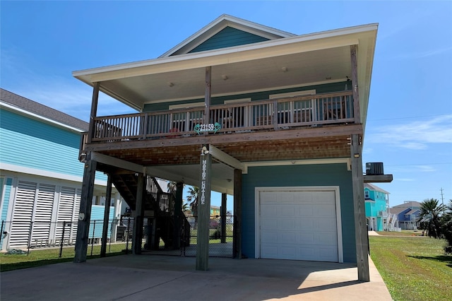 coastal home with a garage, a carport, and driveway