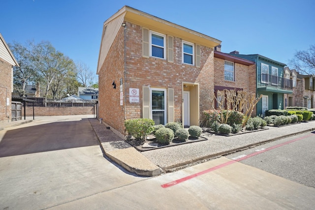 multi unit property with driveway, crawl space, and brick siding