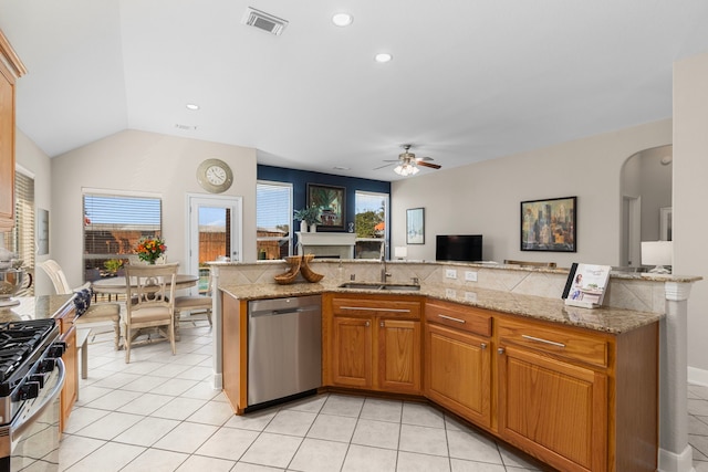 kitchen with a sink, stainless steel appliances, visible vents, and light tile patterned flooring