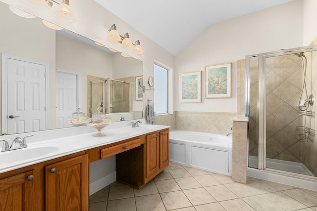 full bath featuring a sink, a bath, a stall shower, and tile patterned flooring