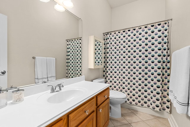 bathroom with tile patterned flooring, curtained shower, toilet, and vanity