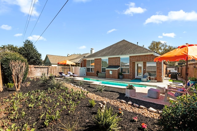 view of pool featuring a patio, a fenced backyard, and a fenced in pool