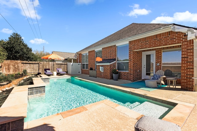 view of swimming pool featuring a fenced in pool, a patio, and fence