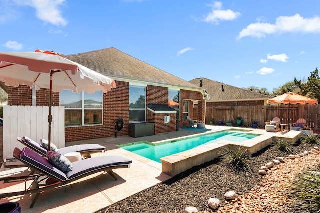 view of swimming pool with a patio area, a fenced in pool, and a fenced backyard