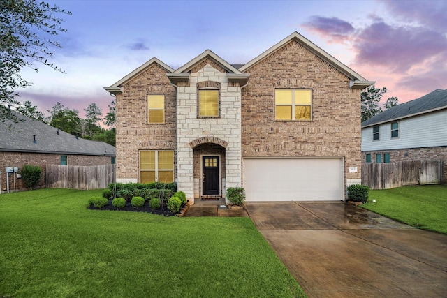 traditional-style home featuring fence, a lawn, and brick siding