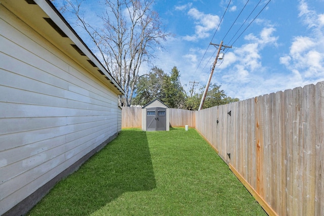 view of yard featuring a fenced backyard, a shed, and an outdoor structure