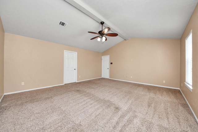 spare room with carpet, plenty of natural light, and visible vents