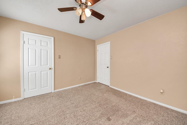 unfurnished bedroom featuring carpet floors, ceiling fan, and baseboards