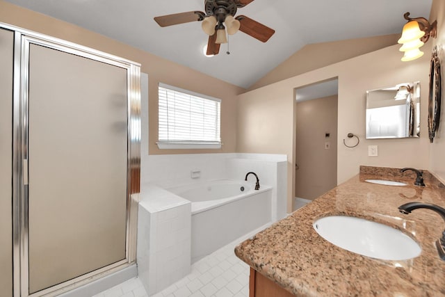 bathroom featuring lofted ceiling, a stall shower, a sink, and a garden tub