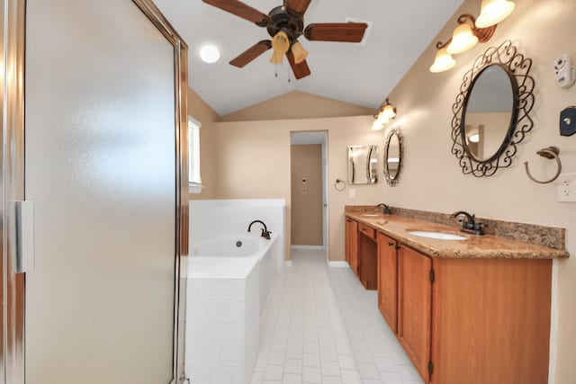 full bathroom featuring vaulted ceiling, a garden tub, a sink, and tile patterned floors