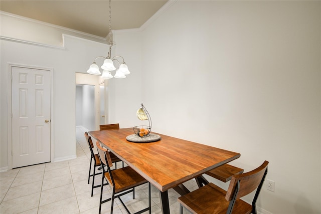 dining space featuring light tile patterned flooring, crown molding, and baseboards