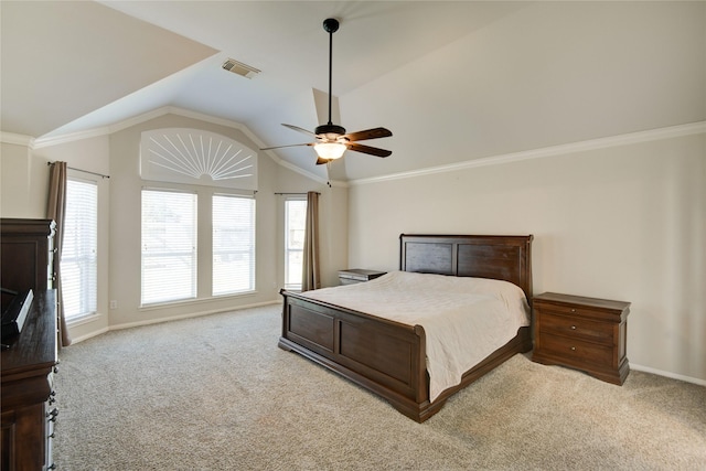 bedroom with lofted ceiling, a ceiling fan, visible vents, carpet, and crown molding