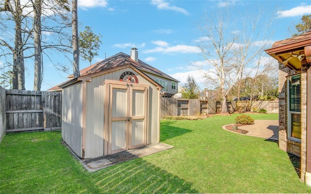 view of shed featuring a fenced backyard