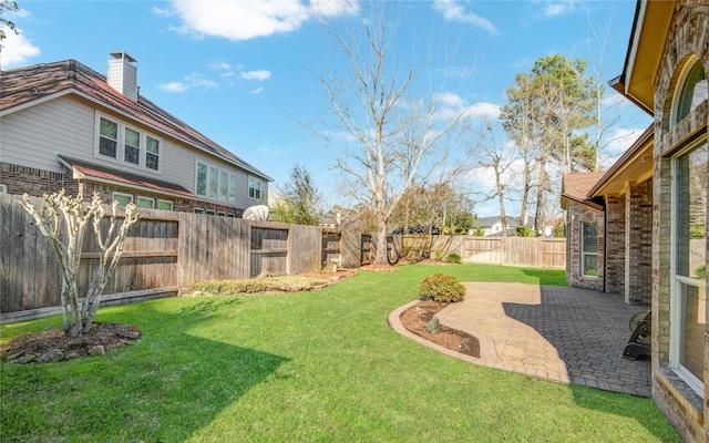 view of yard featuring a fenced backyard and a patio