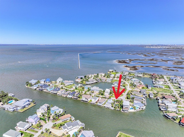 drone / aerial view featuring a residential view and a water view